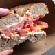 Image for article titled Stop crapping on Cynthia Nixon—lox and capers on a cinnamon-raisin bagel tastes just fine
